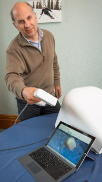 ARANZ Medical chief executive Dr Bruce Davey demonstrates FastSCAN II